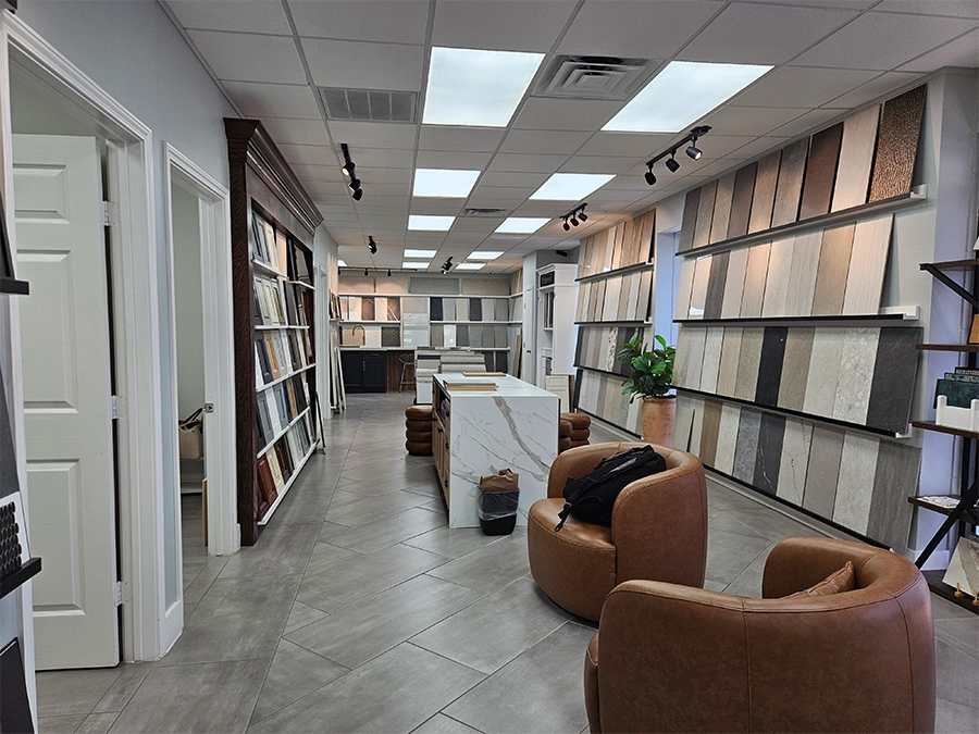 Flooring racks and installed tile displayed inside the Unique BKB showroom